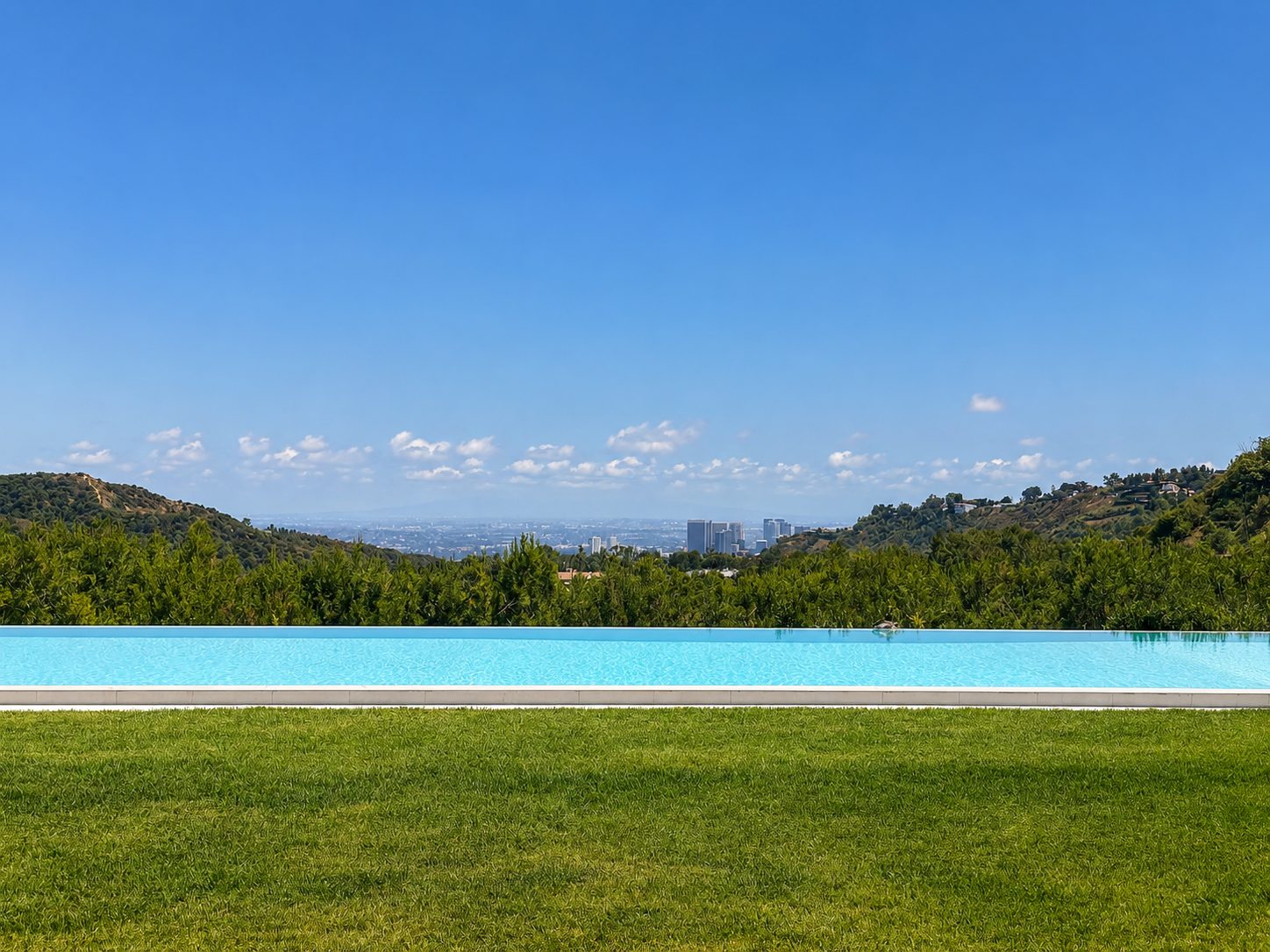 Luxury estate in North Beverly Park, Beverly Hills with panoramic city views and resort style grounds.